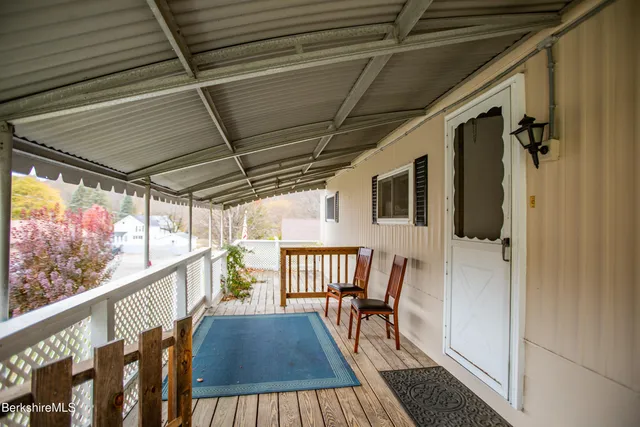 a view of balcony with furniture