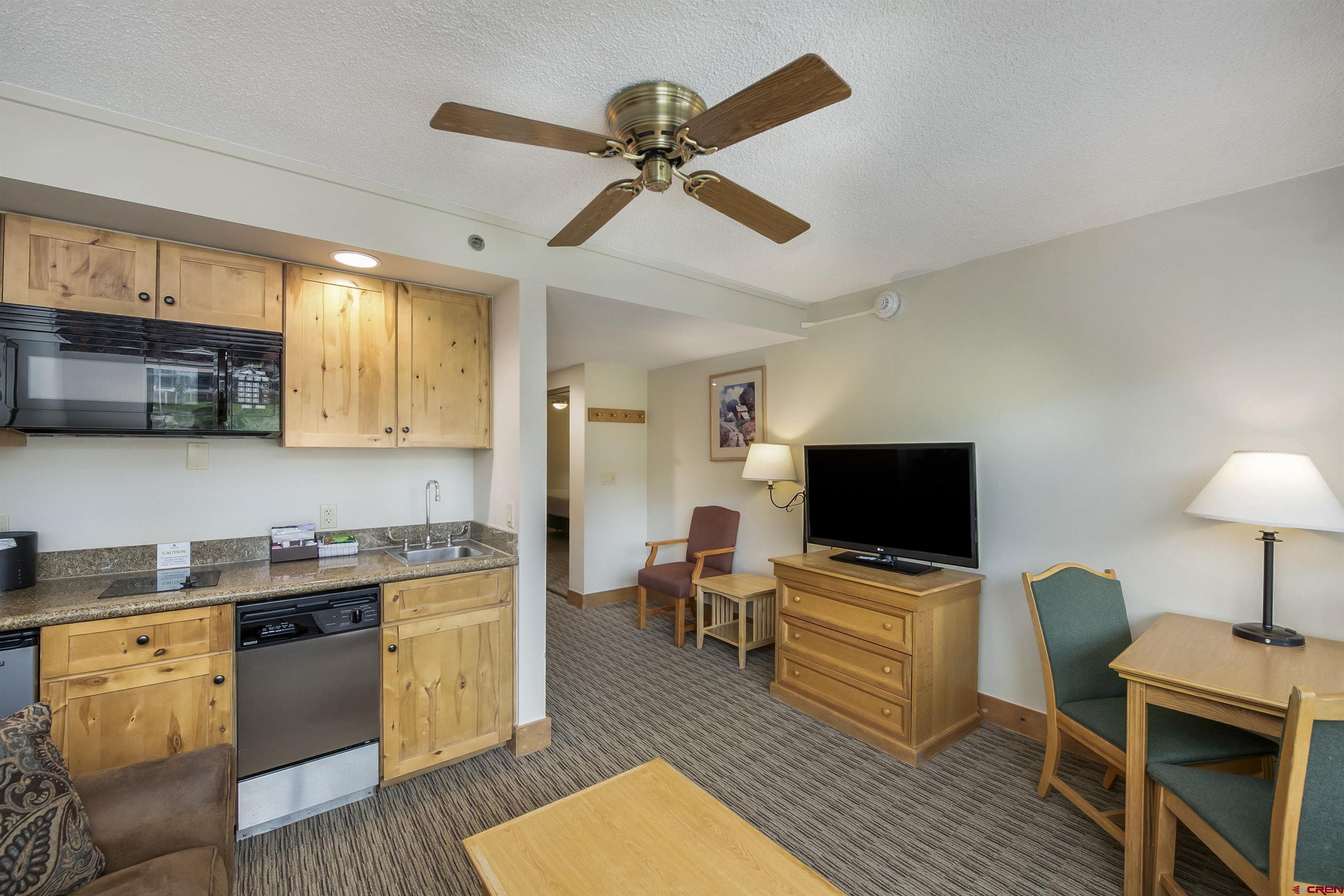 6 Emmons Road, Unit 572 Crested Butte, CO 81225 - Photo 12 of 26 a view of kitchen with cabinets and wooden floor