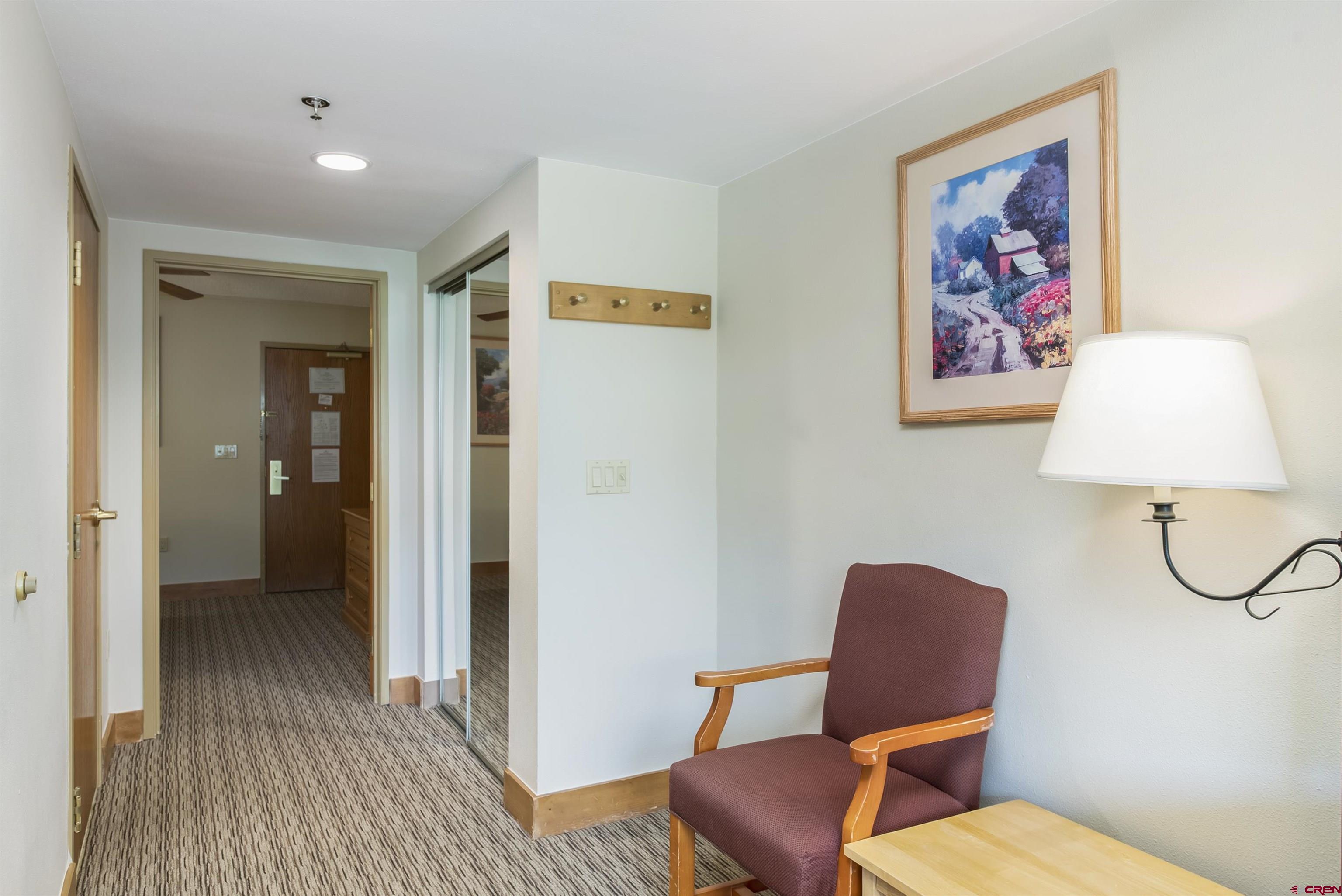 6 Emmons Road, Unit 572 Crested Butte, CO 81225 - Photo 13 of 26 a bathroom with a toilet and a painting on the wall