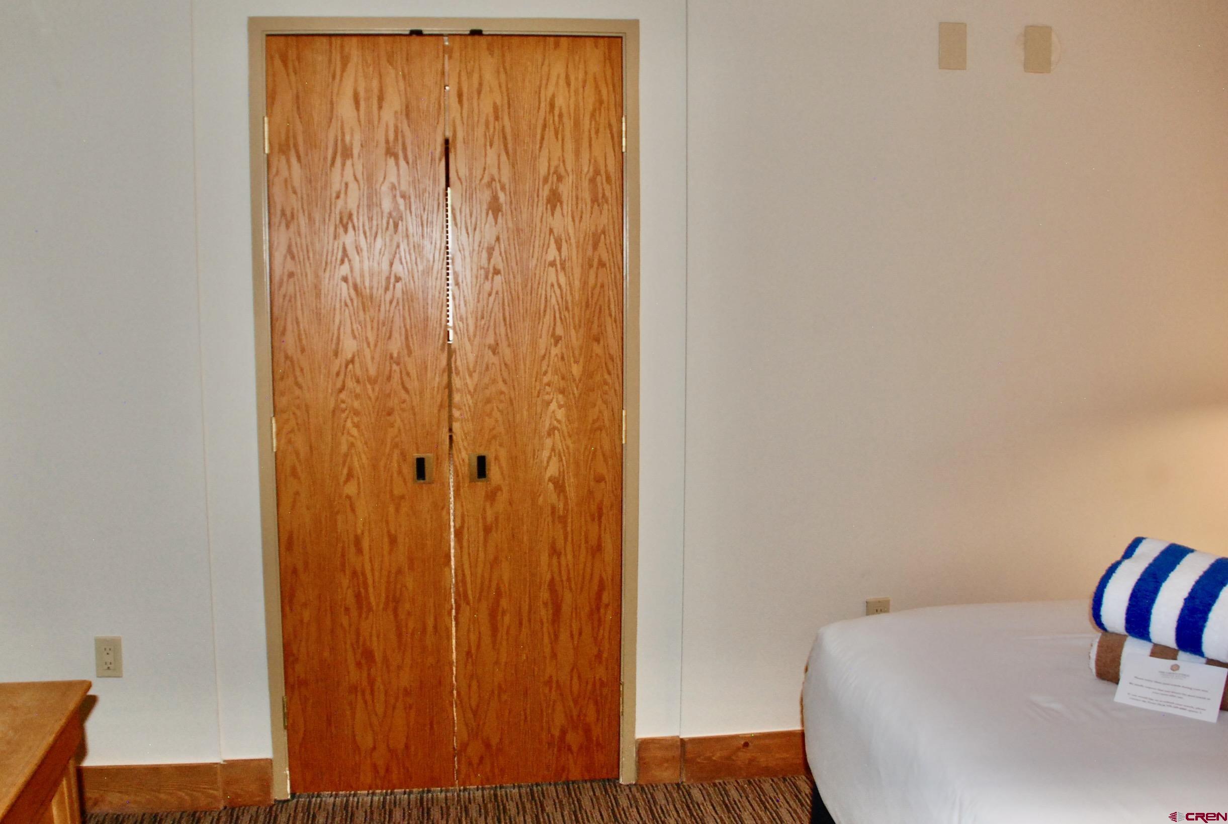 6 Emmons Road, Unit 572 Crested Butte, CO 81225 - Photo 8 of 26 a view of a bedroom with a bed and wooden floor