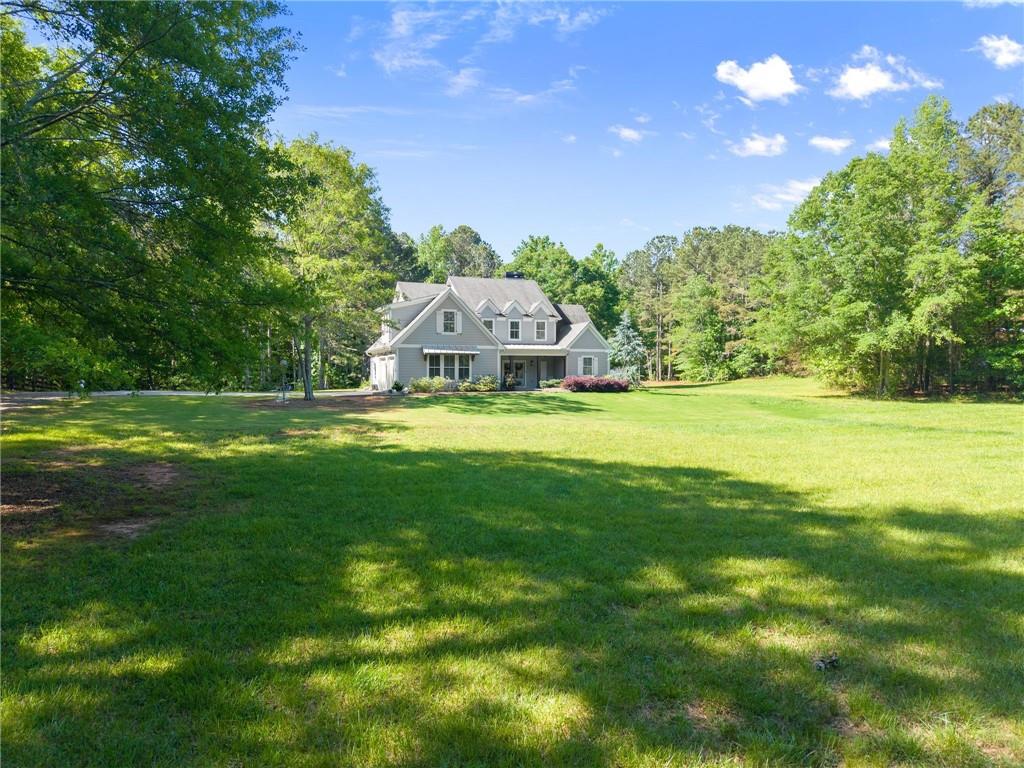 5822 John Burruss Road Cumming, GA 30040 - Photo 45 of 65 a view of a house with a big yard