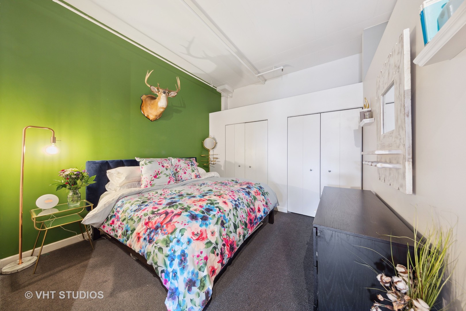 1301 West Madison Street, Unit 314 Chicago, IL 60607 - Photo 11 of 14 a bedroom with a bed and a painting on the wall