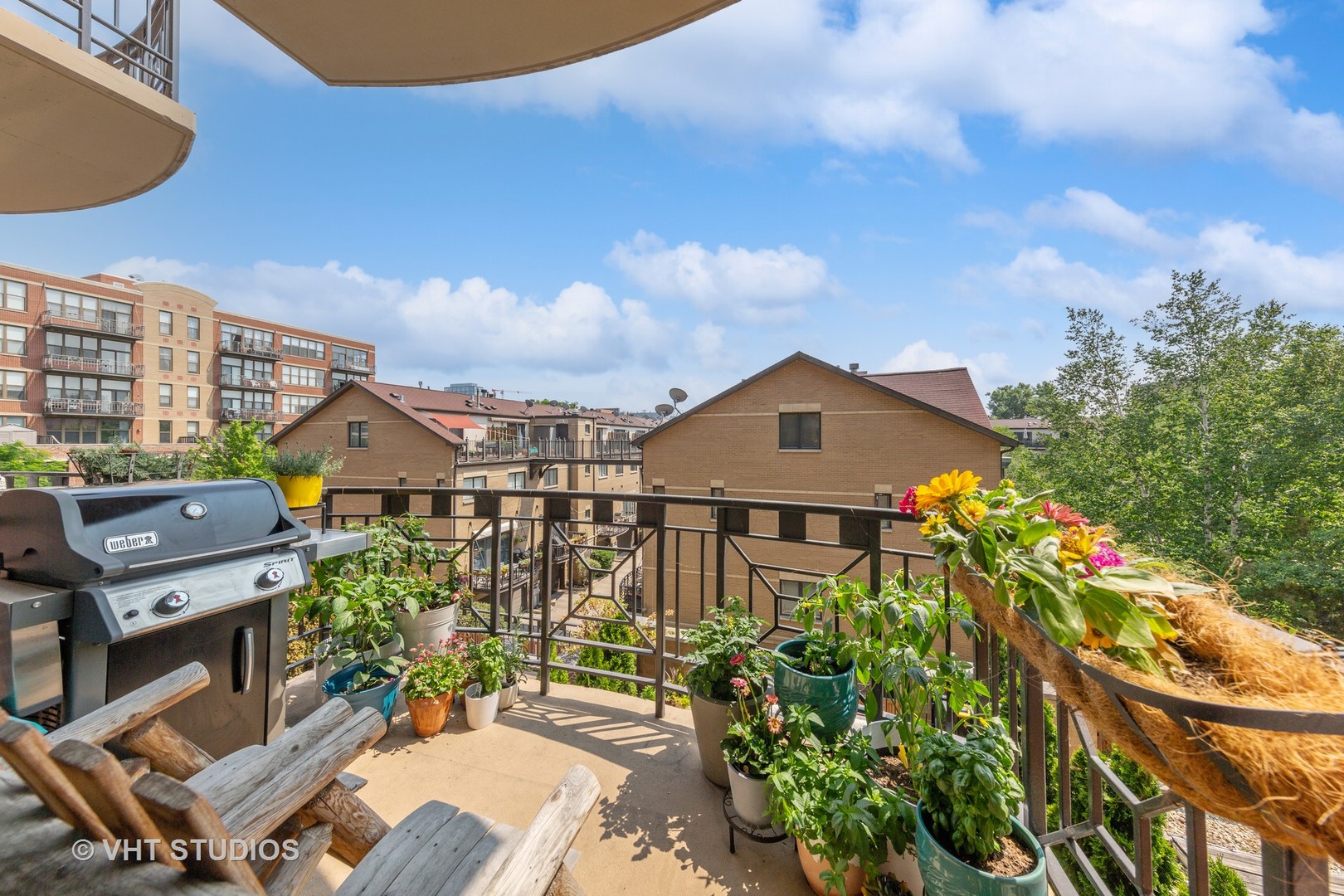 1301 West Madison Street, Unit 314 Chicago, IL 60607 - Photo 14 of 14 an aerial view of a house with a yard and potted plants