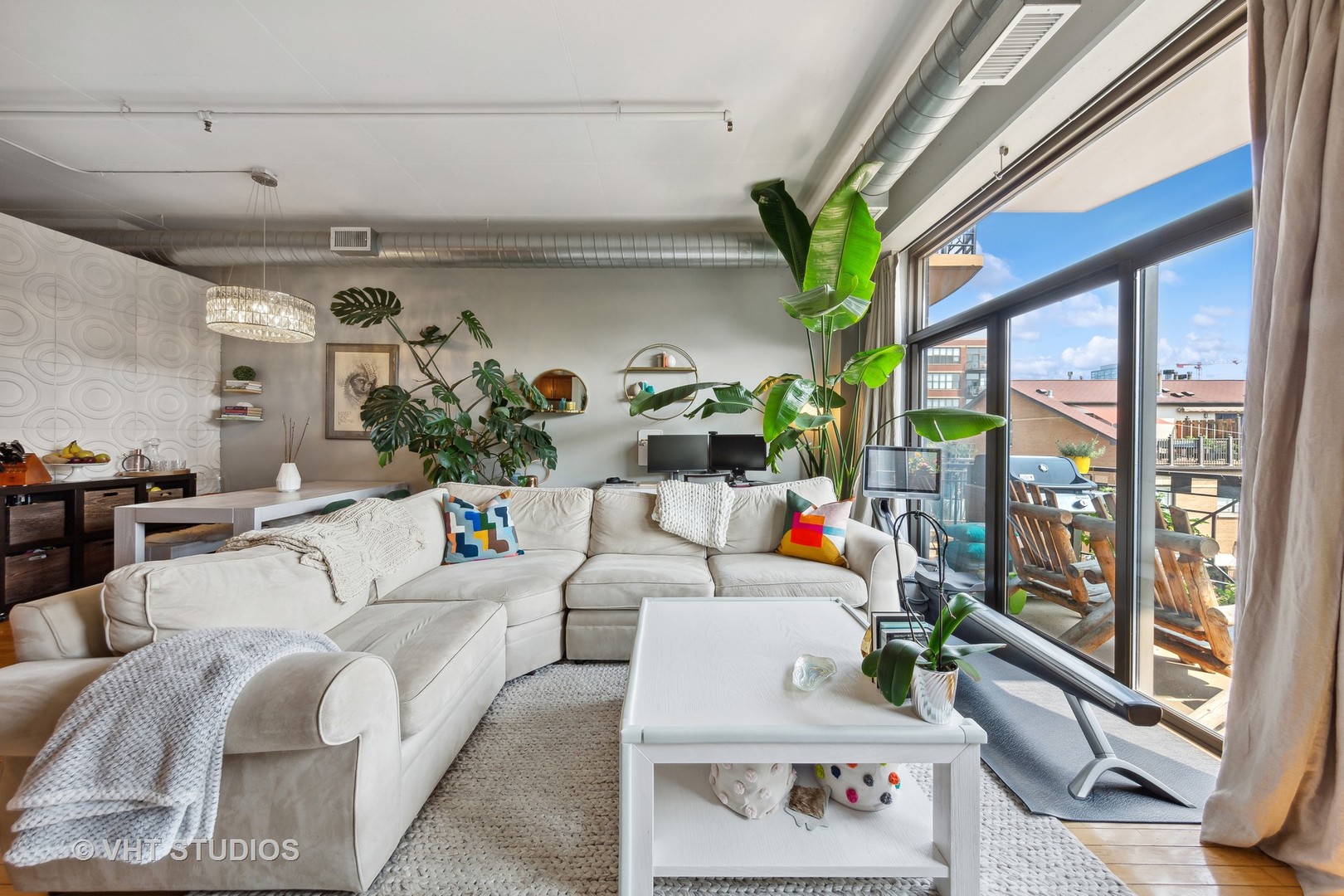 1301 West Madison Street, Unit 314 Chicago, IL 60607 - Photo 4 of 14 a living room with furniture and a potted plant