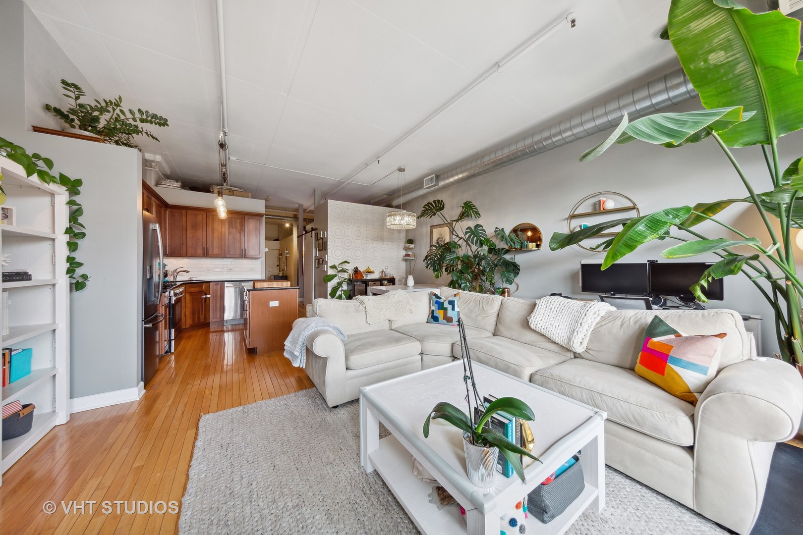 1301 West Madison Street, Unit 314 Chicago, IL 60607 - Photo 5 of 14 a living room with furniture and a couch