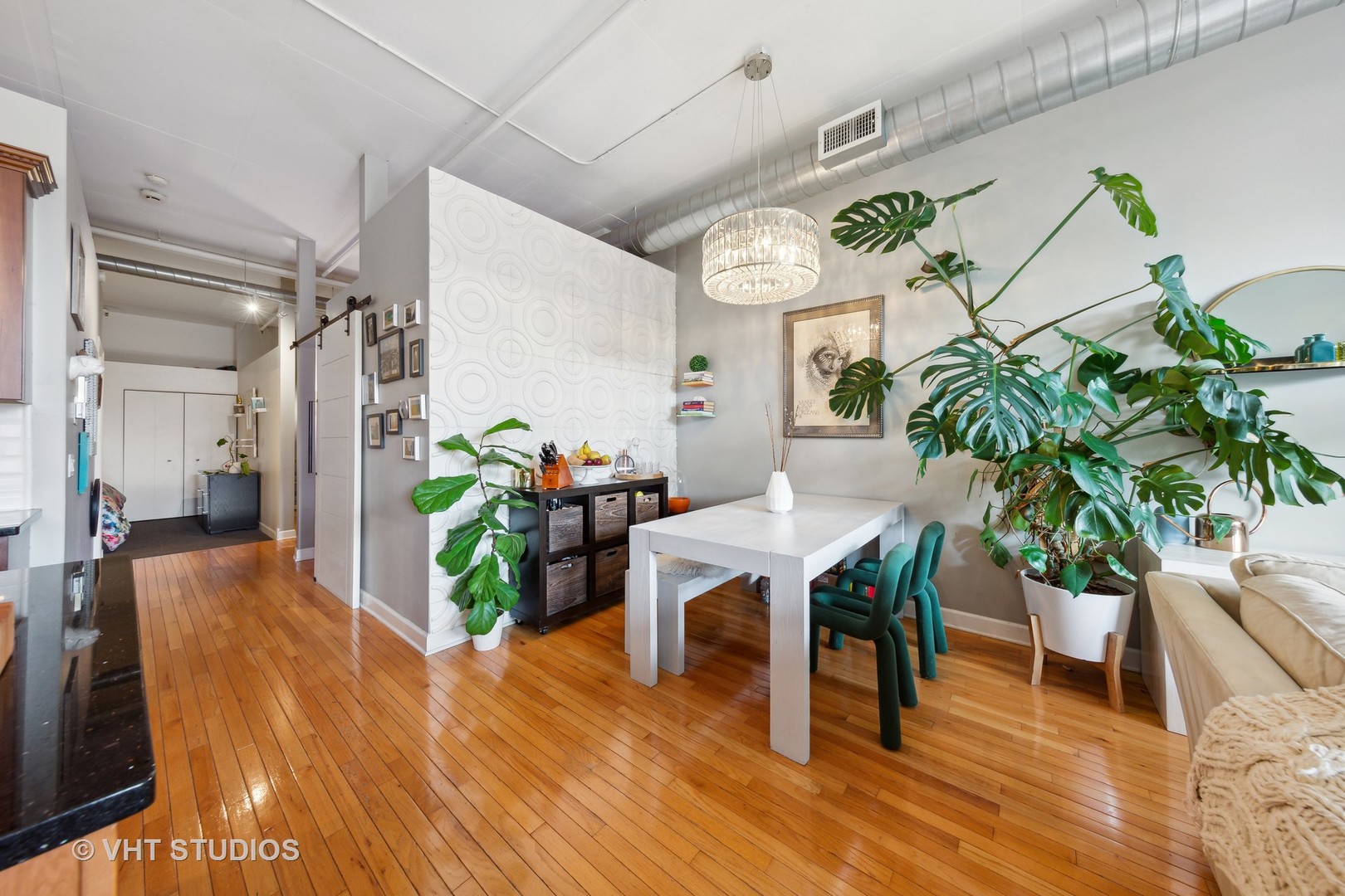 1301 West Madison Street, Unit 314 Chicago, IL 60607 - Photo 10 of 14 a living room with furniture and a potted plant