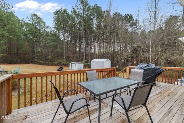 a view of a chairs and table on the deck