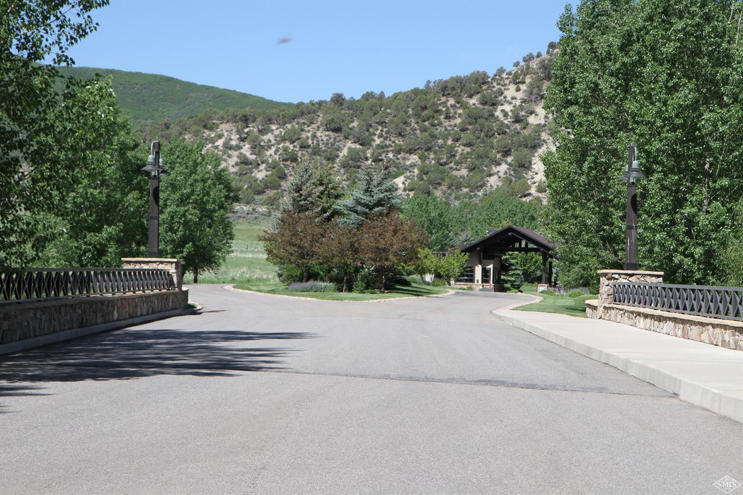 599 Gray Rock Drive Eagle, CO 81631 - Photo 12 of 19 a view of a road with a bench in the background