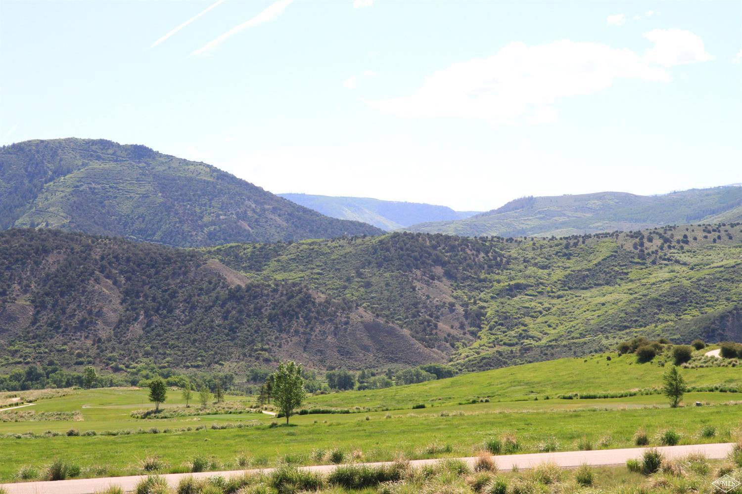 599 Gray Rock Drive Eagle, CO 81631 - Photo 13 of 19 a view of a lush green hillside and houses