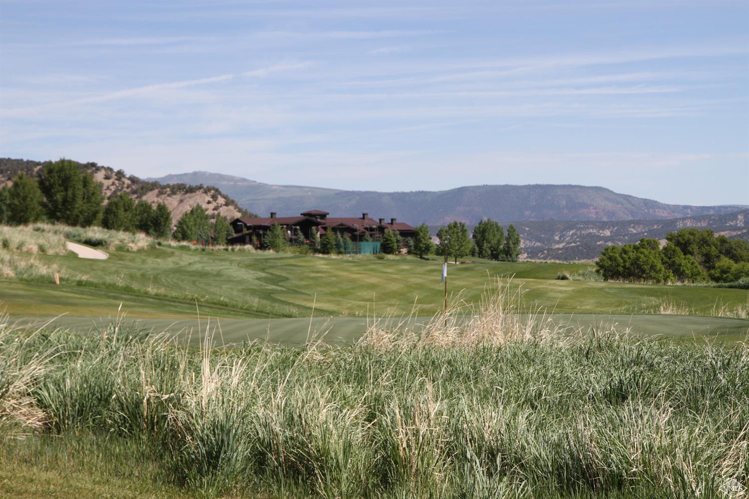 599 Gray Rock Drive Eagle, CO 81631 - Photo 6 of 19 a view of a lake with a mountain in the background