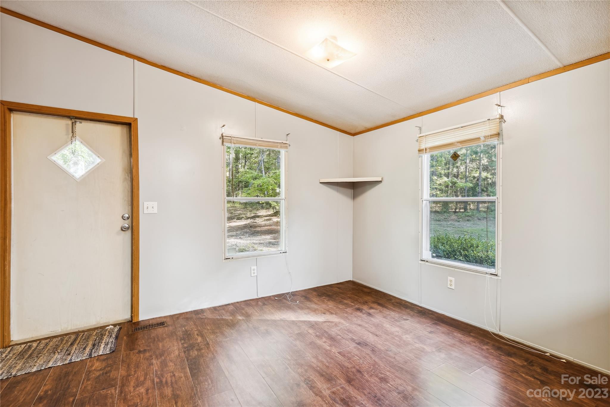 4670 Blade Run Road Edgemoor, SC 29712 - Photo 11 of 26 an empty room with windows