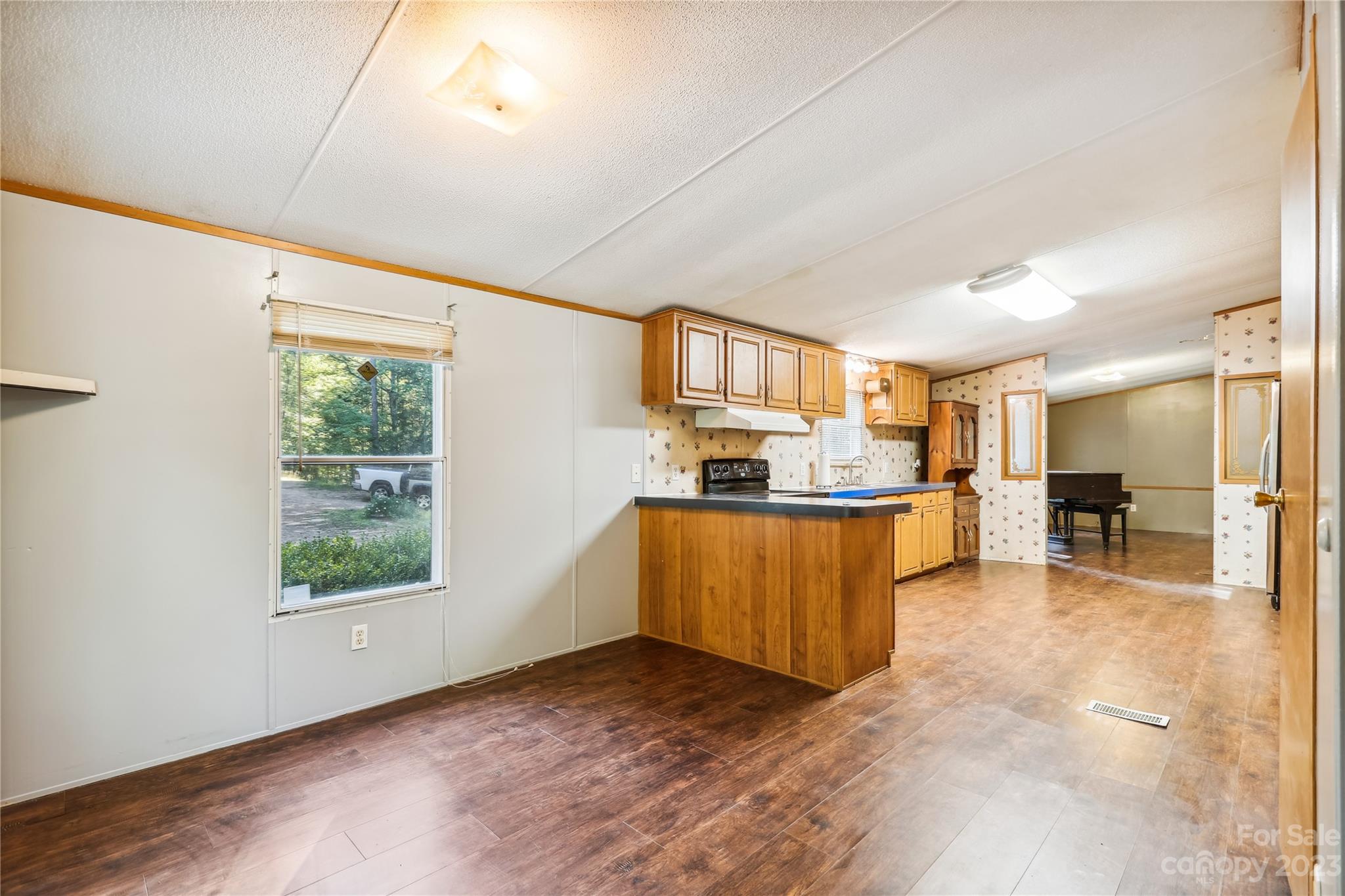 4670 Blade Run Road Edgemoor, SC 29712 - Photo 12 of 26 a view of a kitchen with furniture and a window