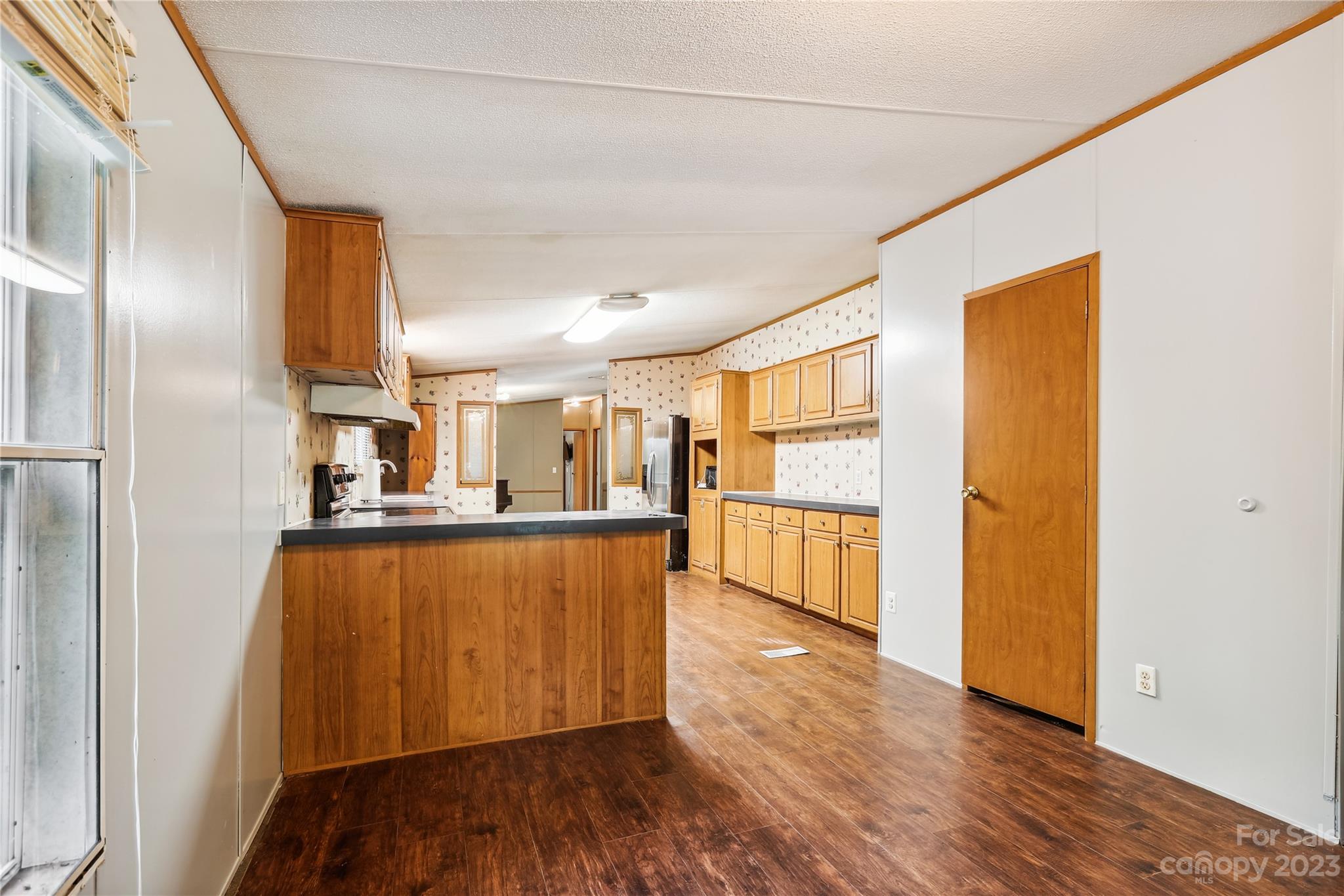 4670 Blade Run Road Edgemoor, SC 29712 - Photo 13 of 26 a kitchen with stainless steel appliances a refrigerator and a stove
