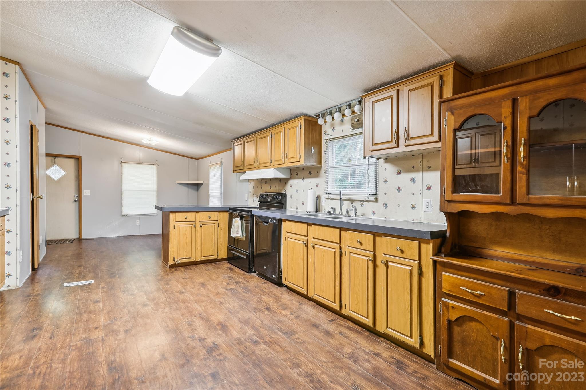 4670 Blade Run Road Edgemoor, SC 29712 - Photo 15 of 26 a kitchen with stainless steel appliances granite countertop a sink and cabinets