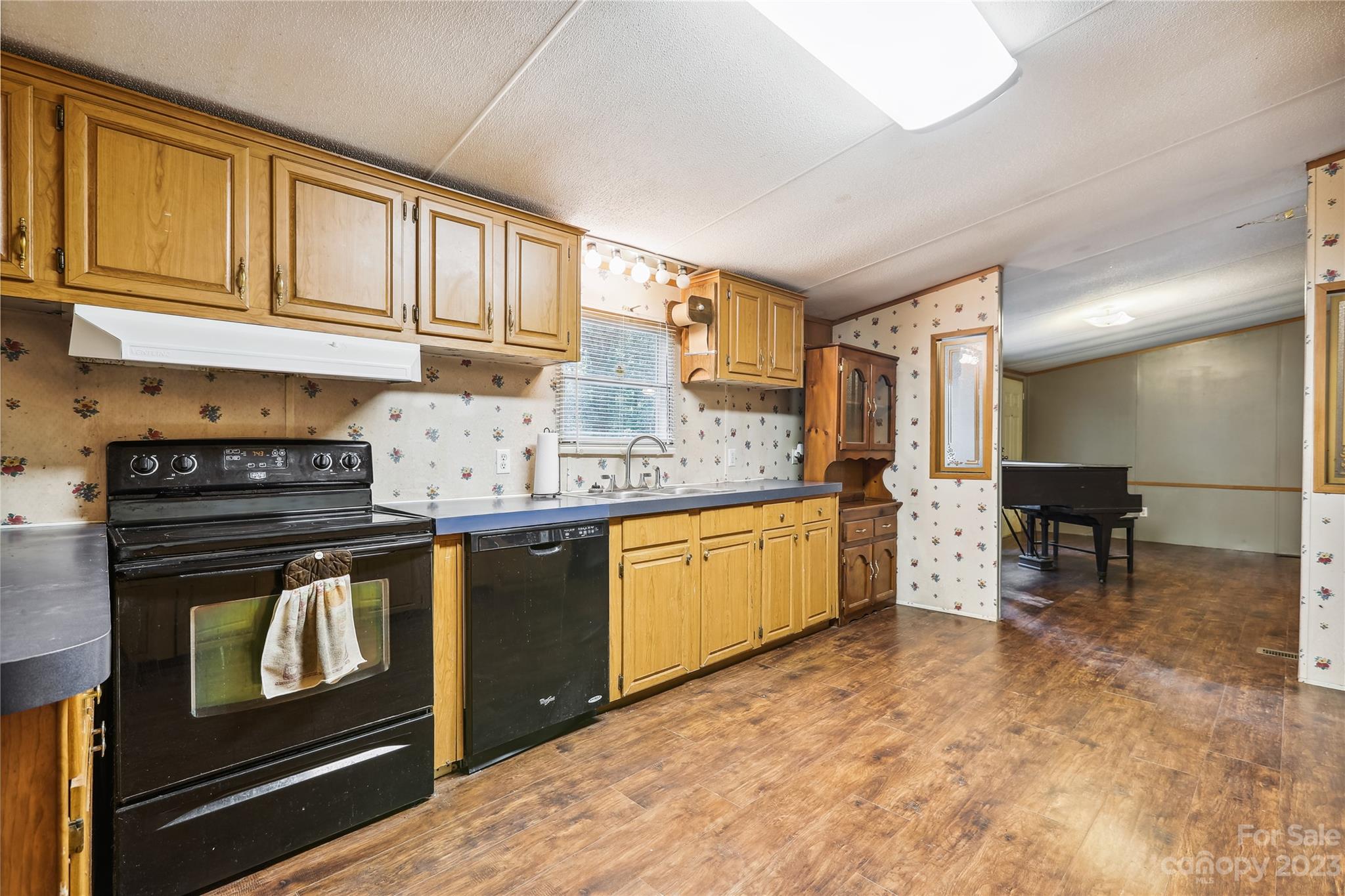 4670 Blade Run Road Edgemoor, SC 29712 - Photo 16 of 26 a kitchen with stainless steel appliances granite countertop a stove a sink and a refrigerator