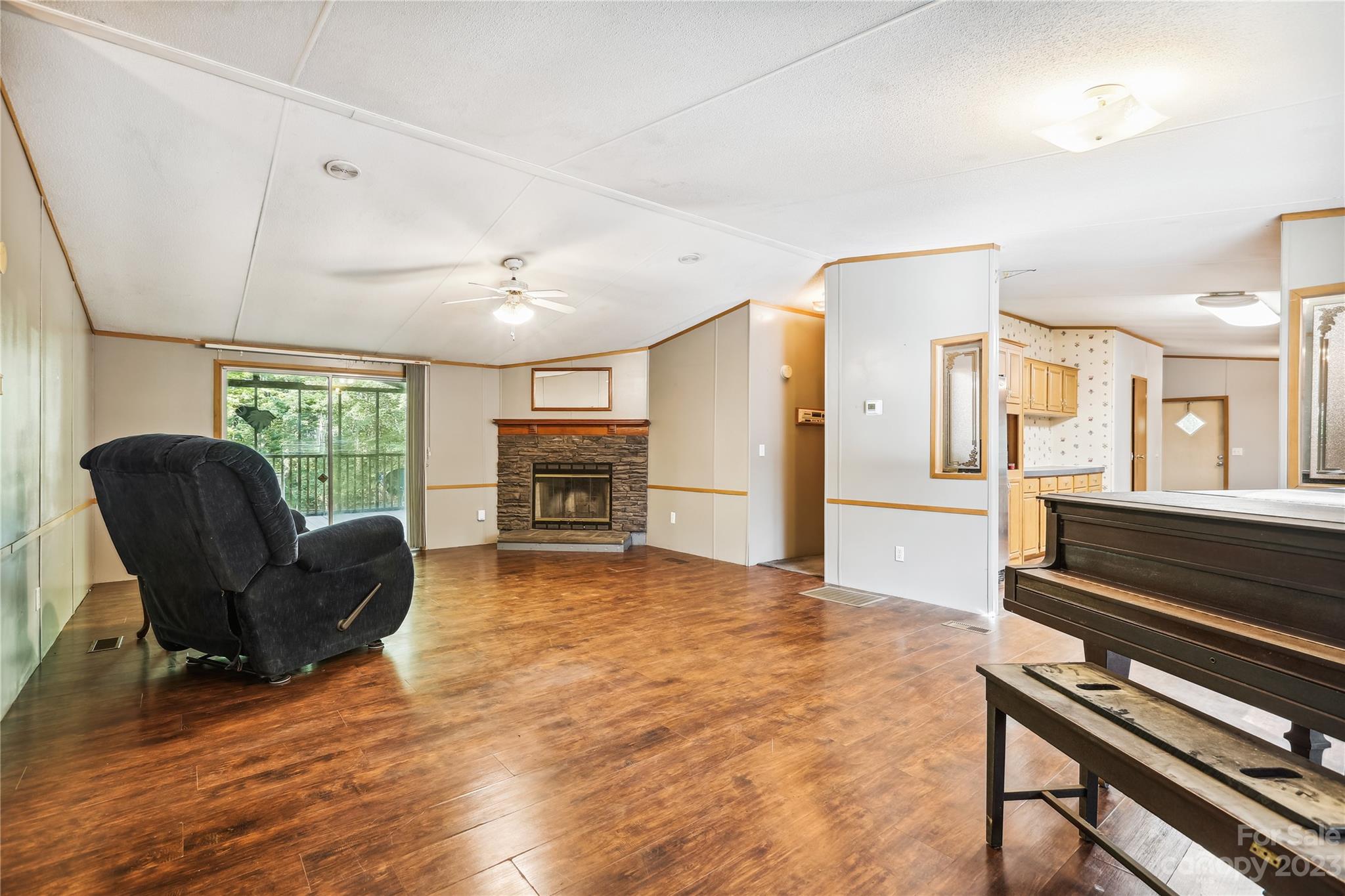 4670 Blade Run Road Edgemoor, SC 29712 - Photo 20 of 26 a living room with furniture and a fireplace