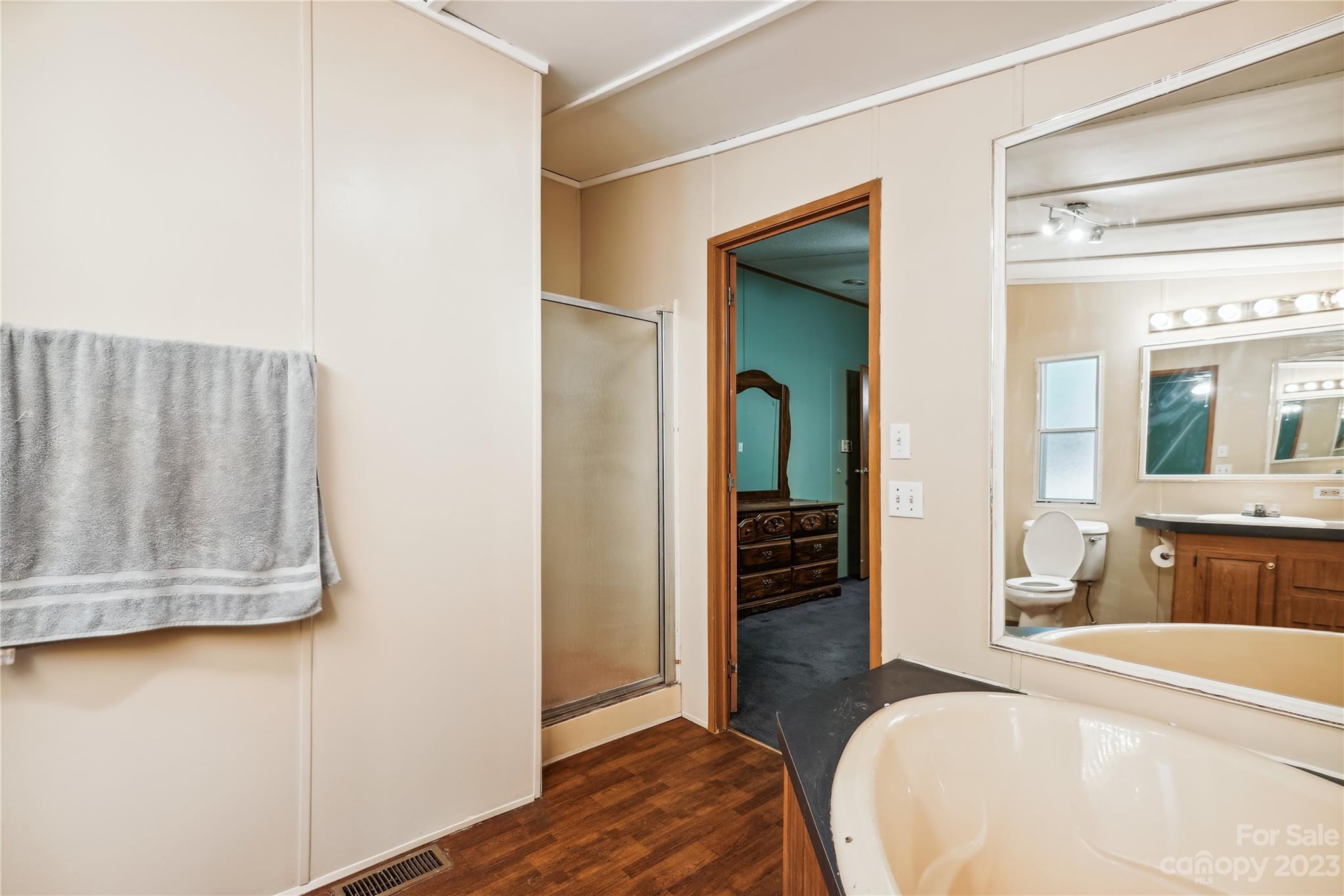 4670 Blade Run Road Edgemoor, SC 29712 - Photo 22 of 26 a bedroom with a bed and wooden floor