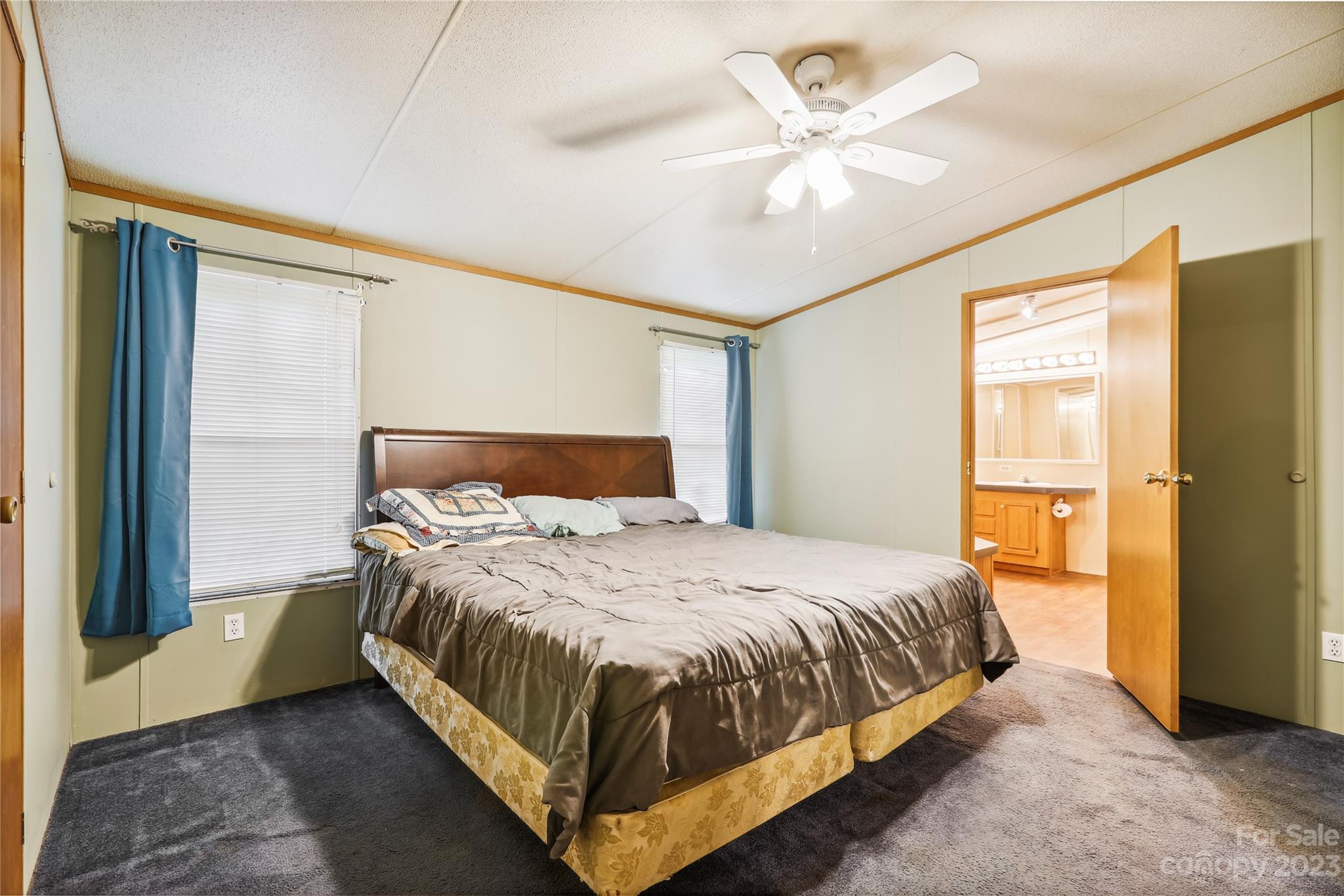 4670 Blade Run Road Edgemoor, SC 29712 - Photo 23 of 26 a bedroom with a bed chandelier and a window