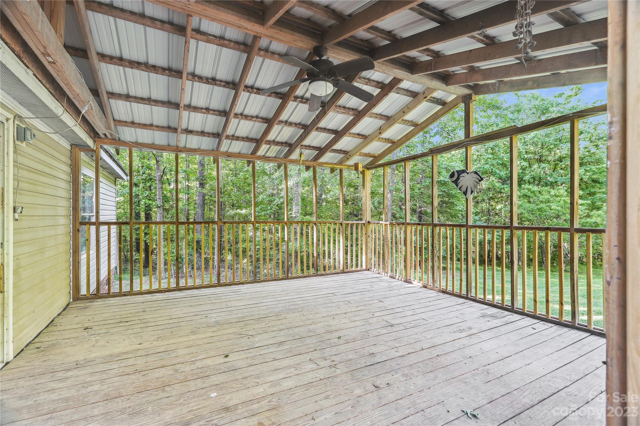 4670 Blade Run Road Edgemoor, SC 29712 - Photo 3 of 26 a view of backyard with large trees and a wooden fence