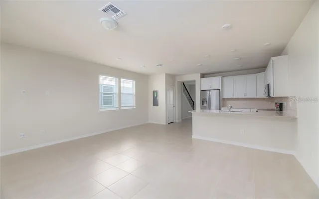 a view of an empty room with a window