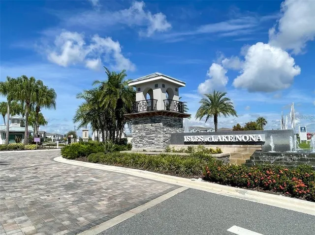 a front view of a house with a garden and a yard