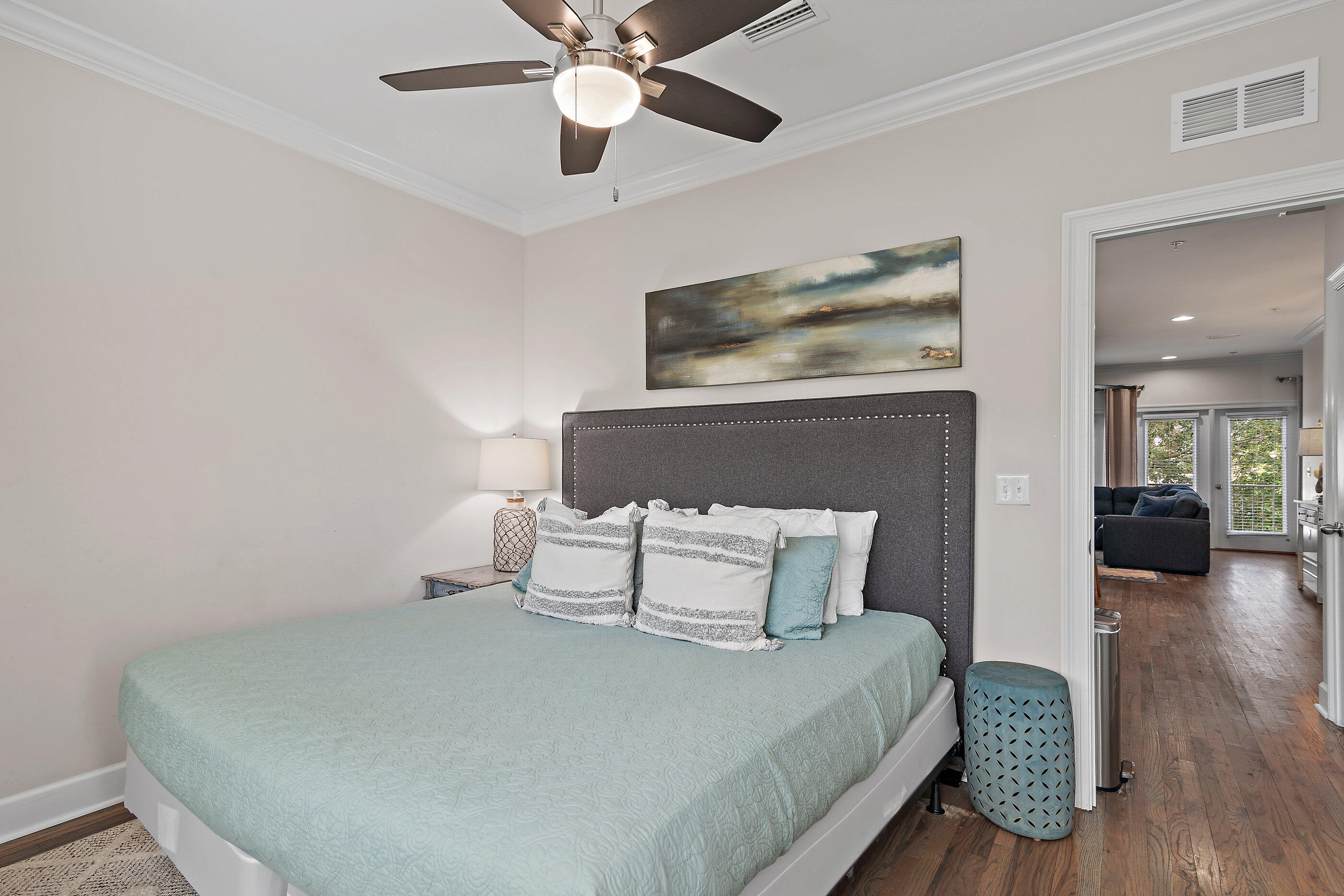 257 Driftwood Road, Unit 11 Miramar Beach, FL 32550 - Photo 15 of 40 a bedroom with a bed and wooden floor