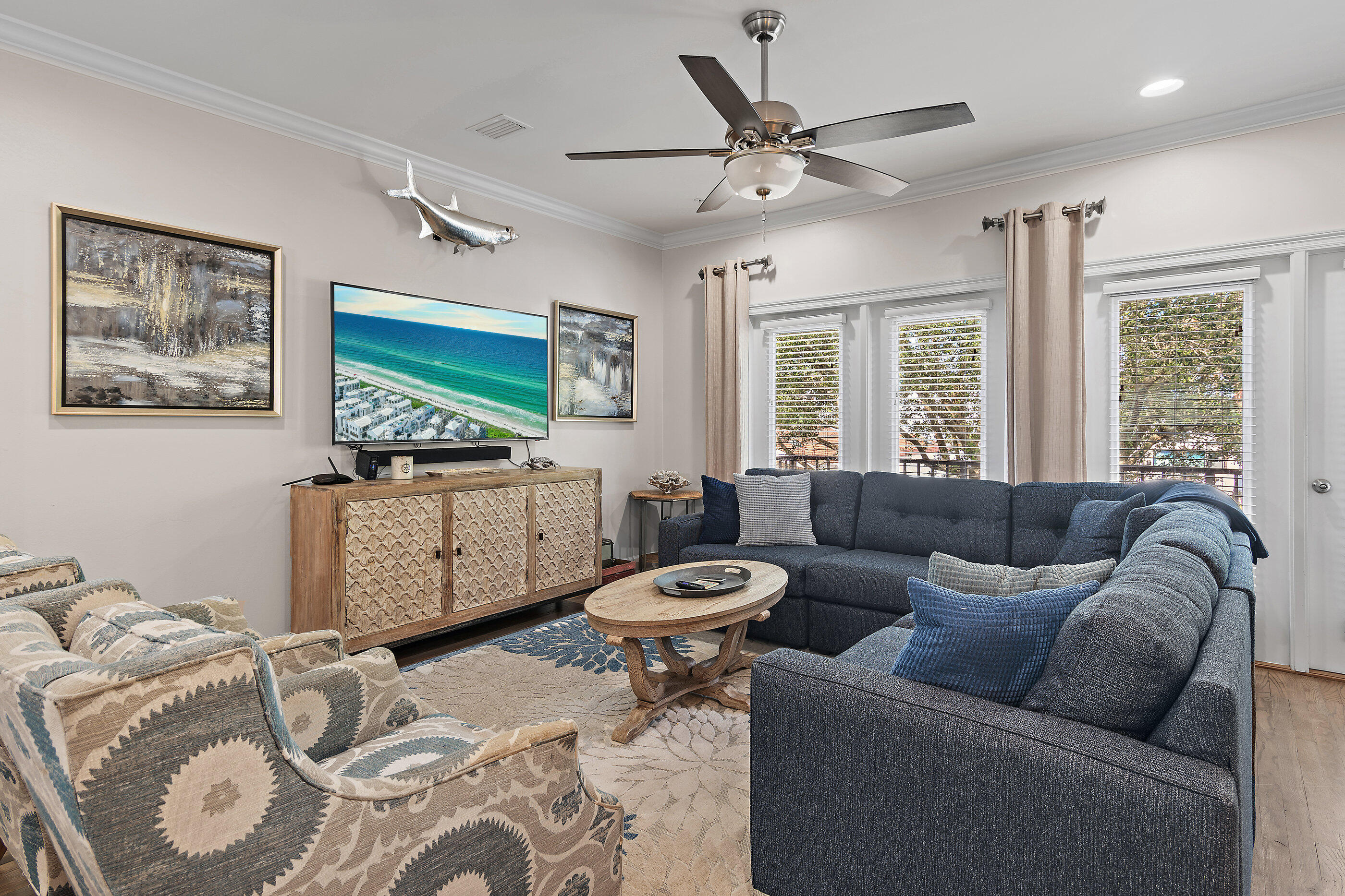 257 Driftwood Road, Unit 11 Miramar Beach, FL 32550 - Photo 2 of 40 a living room with furniture ceiling fan and a window