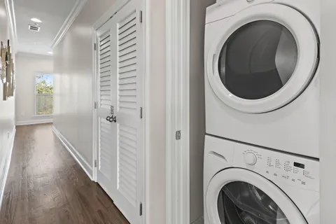 a view of a hallway with washer and dryer