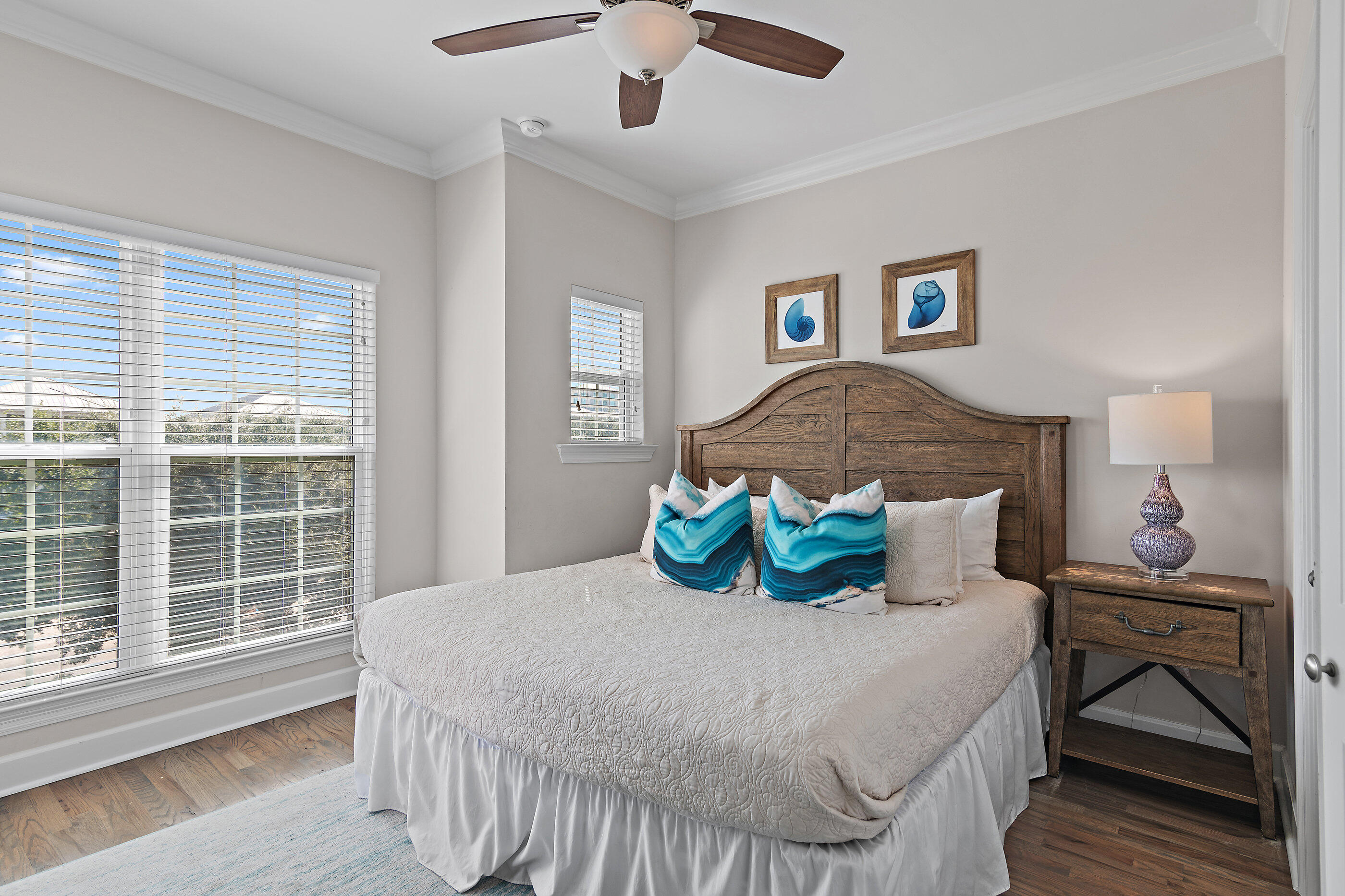 257 Driftwood Road, Unit 11 Miramar Beach, FL 32550 - Photo 24 of 40 a bedroom with a bed and wooden floor