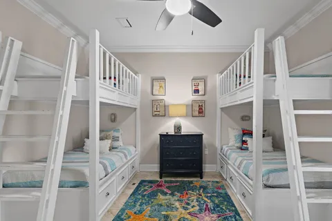 a bedroom with furniture and baby crib