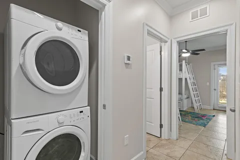 a view of a hallway with washer and dryer