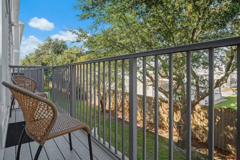 a view of a chair and table in the balcony