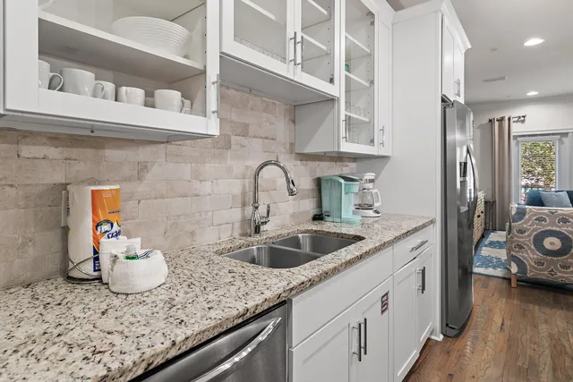 a kitchen with a sink and cabinets
