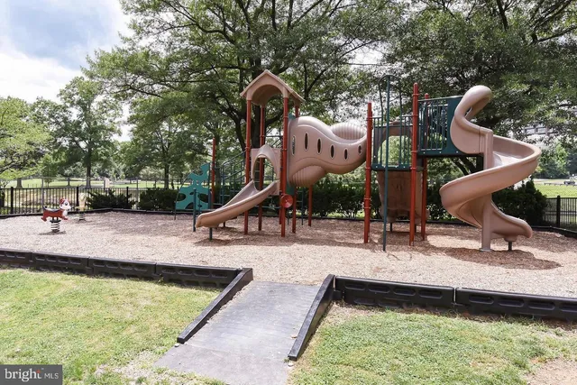 a front view of a building with a yard