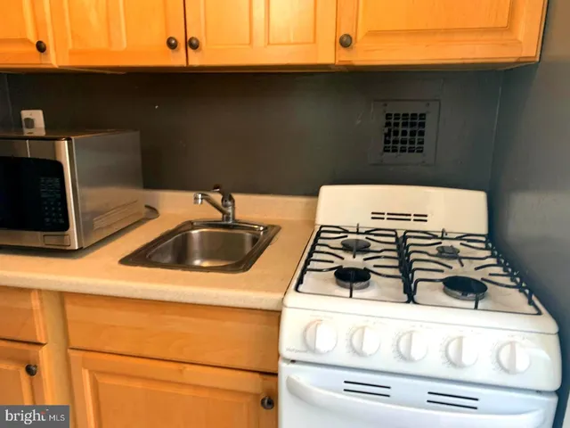 a bathroom with a sink toilet and tub