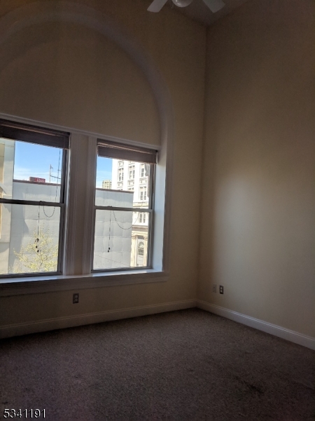 385 George Street, Unit 3B New Brunswick, NJ 08901 - Photo 11 of 18 a view of an empty room with a window