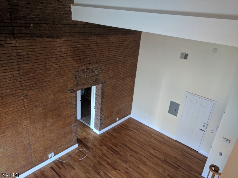 385 George Street, Unit 3B New Brunswick, NJ 08901 - Photo 17 of 18 a view of wooden floor in an empty room