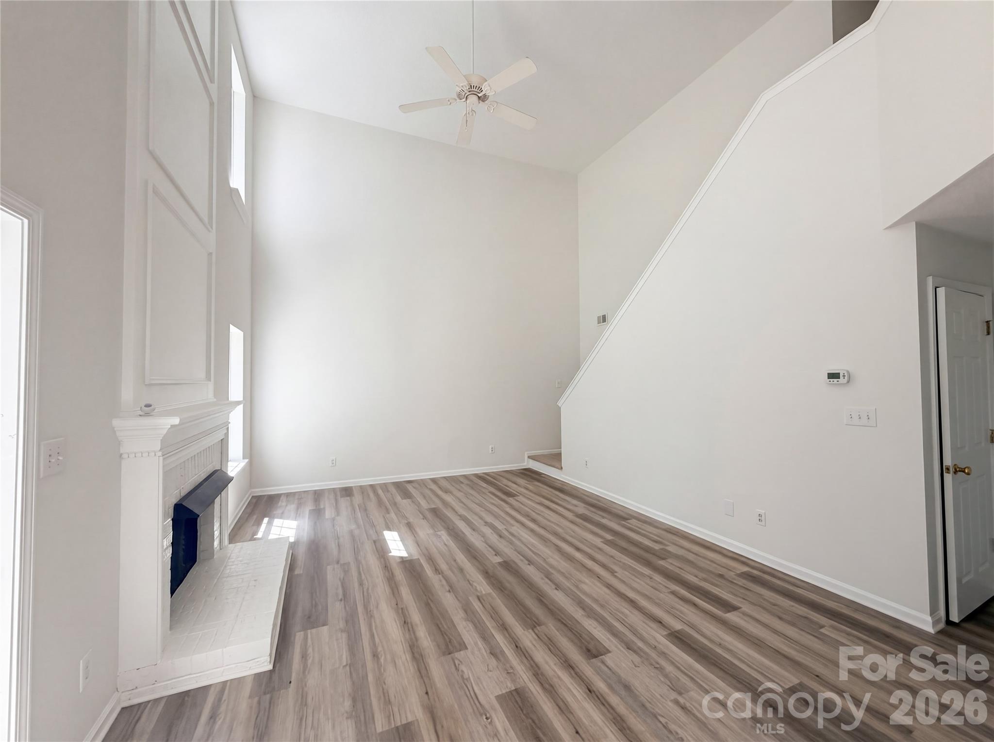 7423 Henderson Park Road Huntersville, NC 28078 - Photo 3 of 16 a view of an empty room with wooden floor and a window