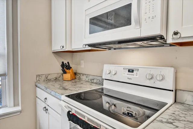a kitchen with a stove and a microwave