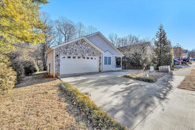a view of a house with a snow in the yard