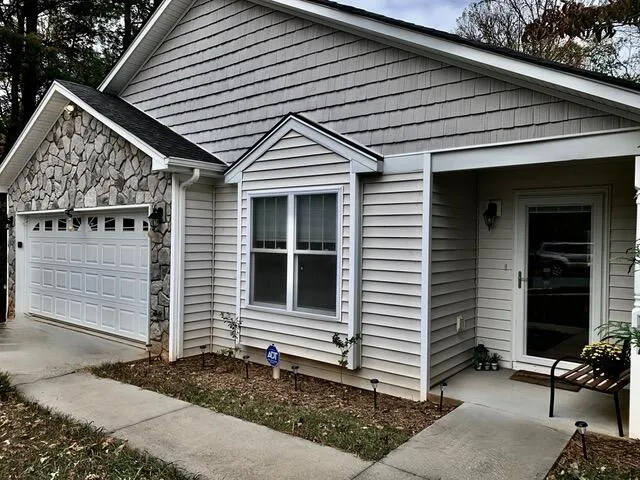 a front view of a house with garage