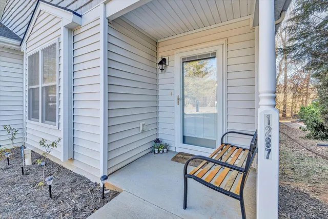 a view of a bench in the backyard