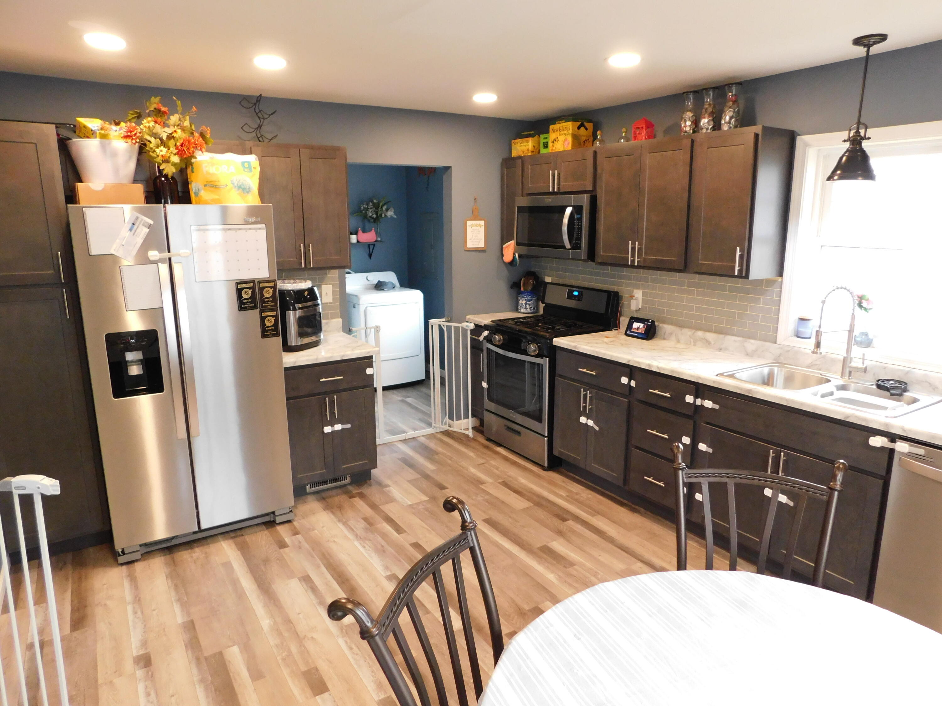 2347 Sloan Street Portage, IN 46368 - Photo 11 of 19 a kitchen with stainless steel appliances a sink a microwave a refrigerator and cabinets