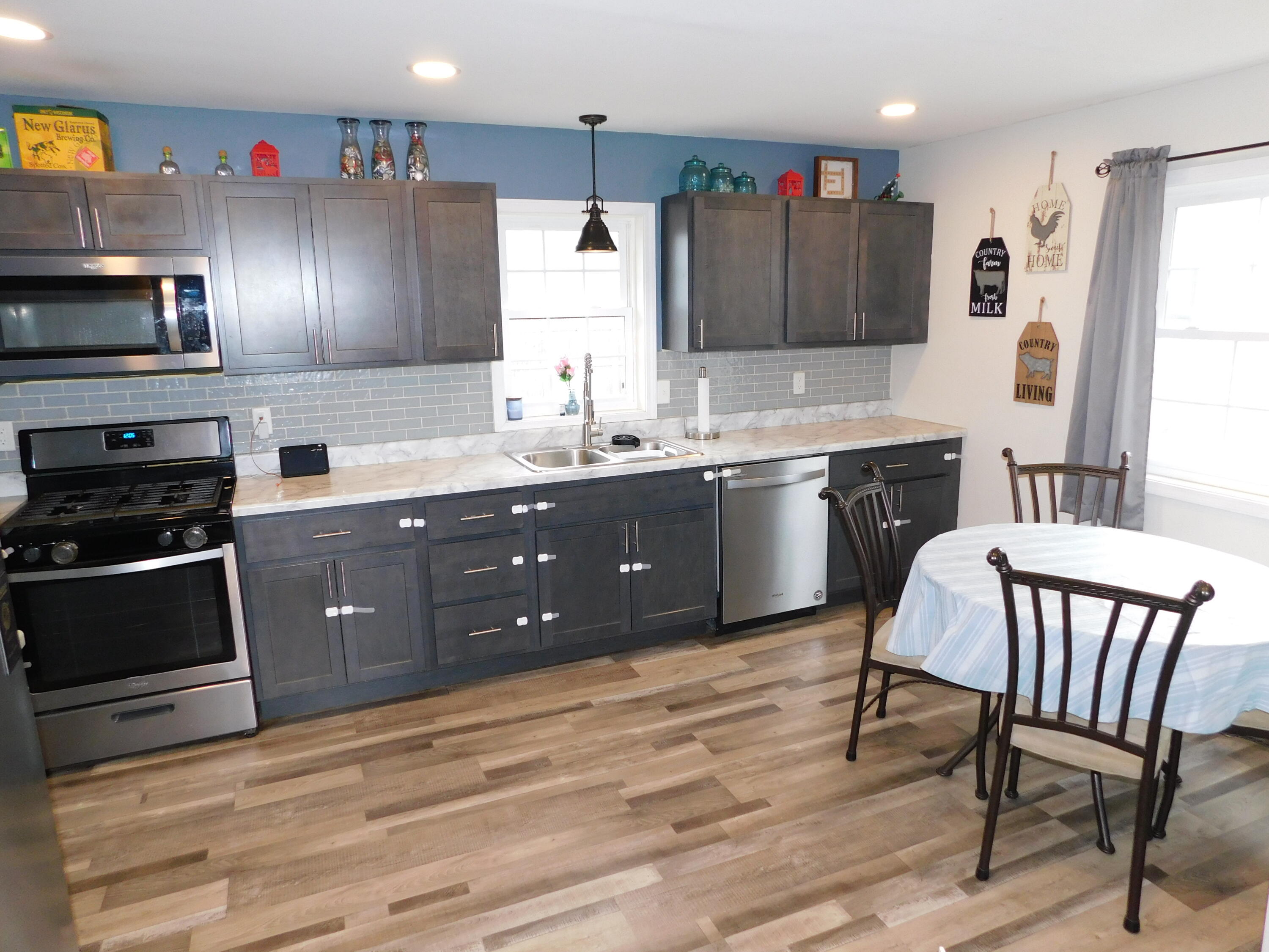 2347 Sloan Street Portage, IN 46368 - Photo 12 of 19 a kitchen with stainless steel appliances granite countertop a sink counter space and chairs