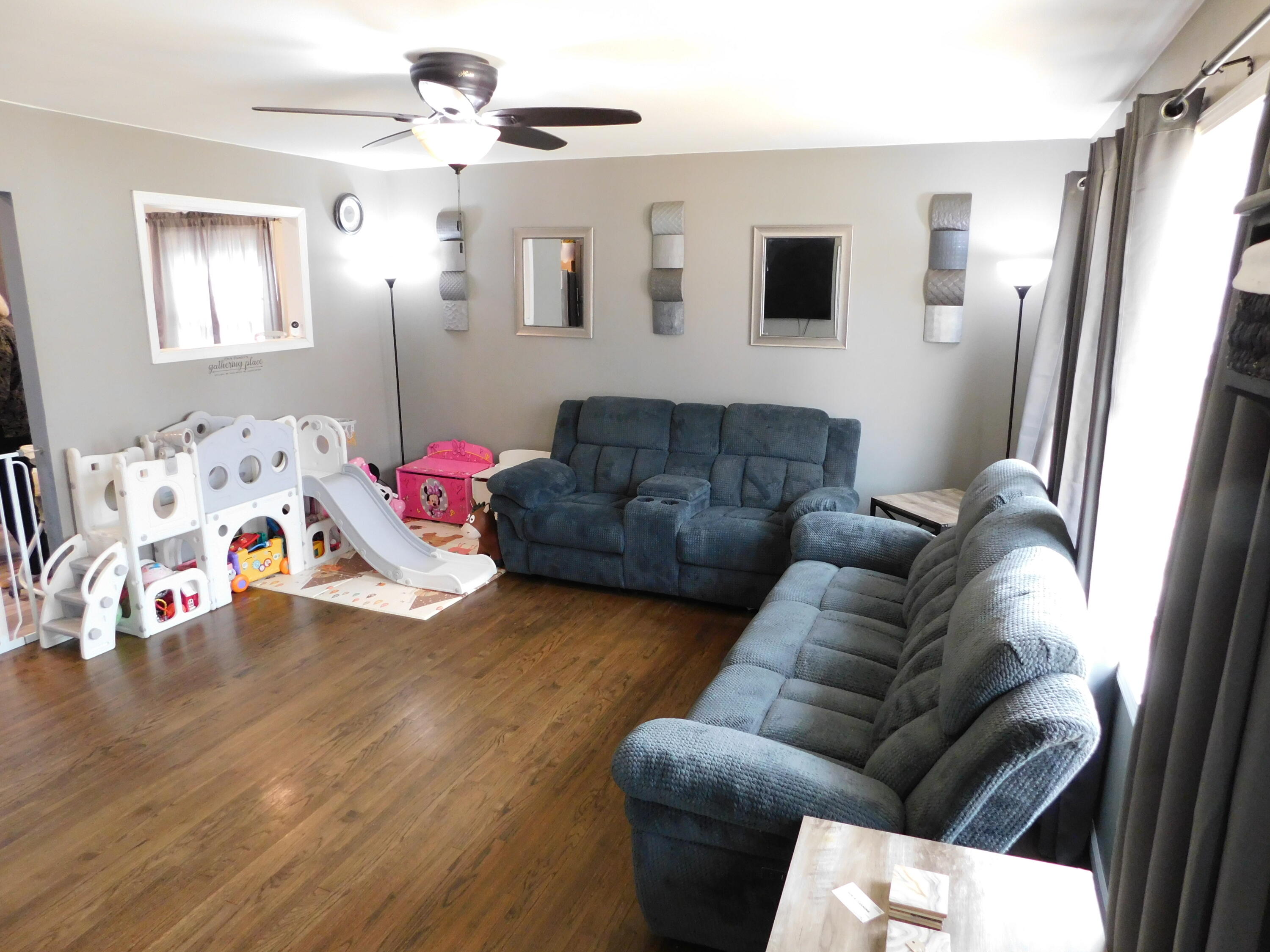 2347 Sloan Street Portage, IN 46368 - Photo 6 of 19 a living room with furniture and a flat screen tv