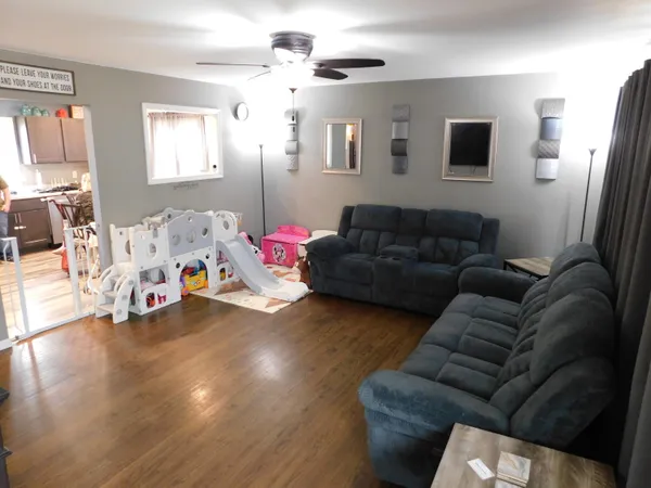 a living room with furniture and a window