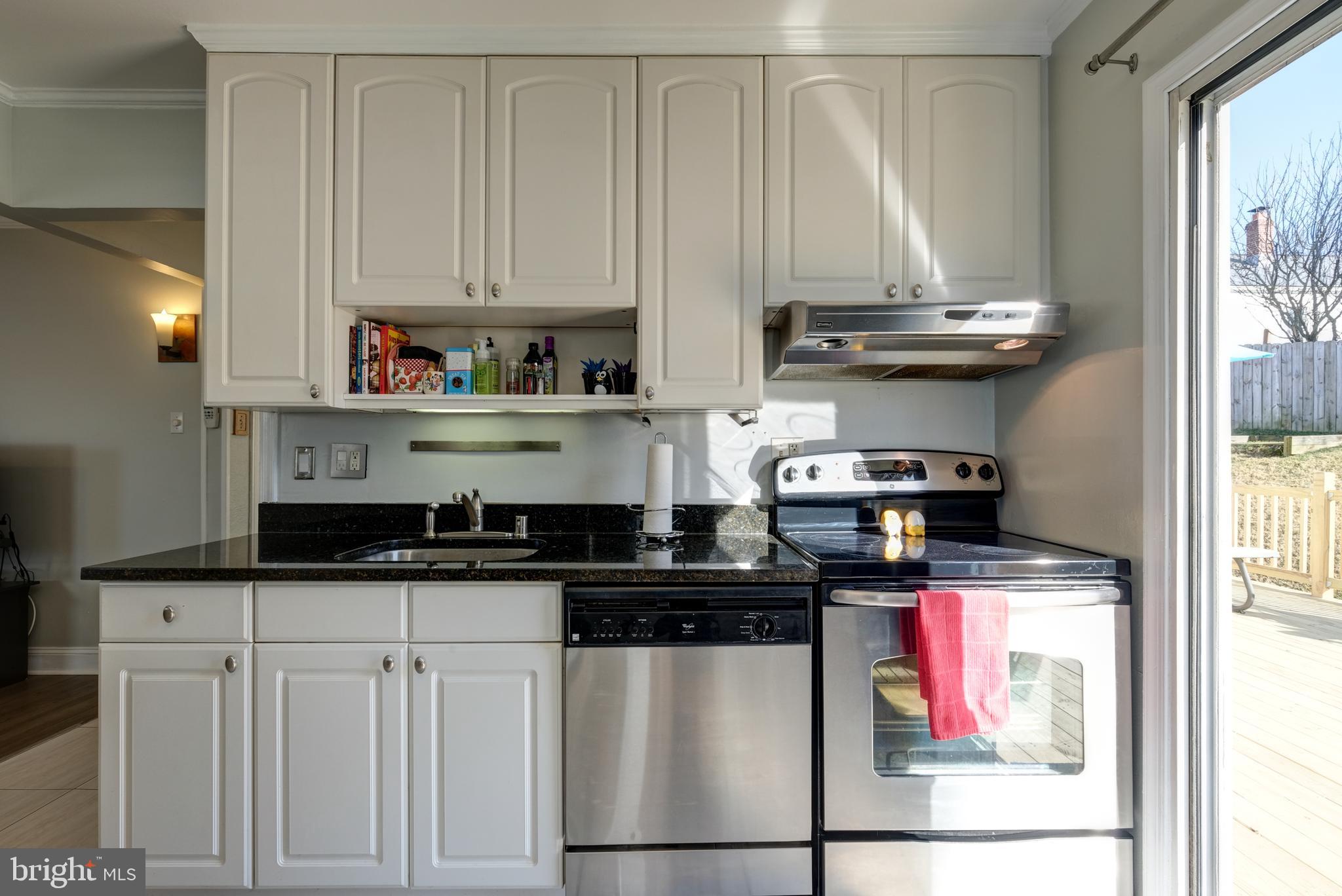 4408 Fernhill Road Silver Spring, MD 20906 - Photo 9 of 47 White Kitchen with Stainless Appliances