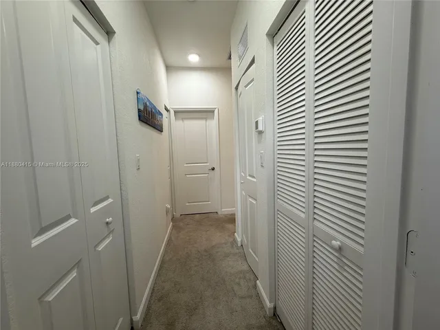 a view of hallway with shower