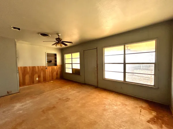 a view of an empty room with a window