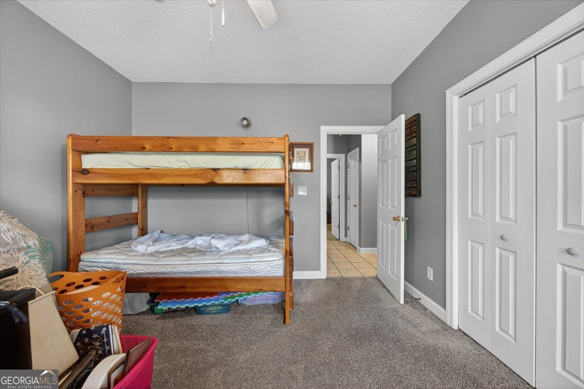 134 Royal Lane Gray, GA 31032 - Photo 19 of 31 a bedroom with furniture and a closet
